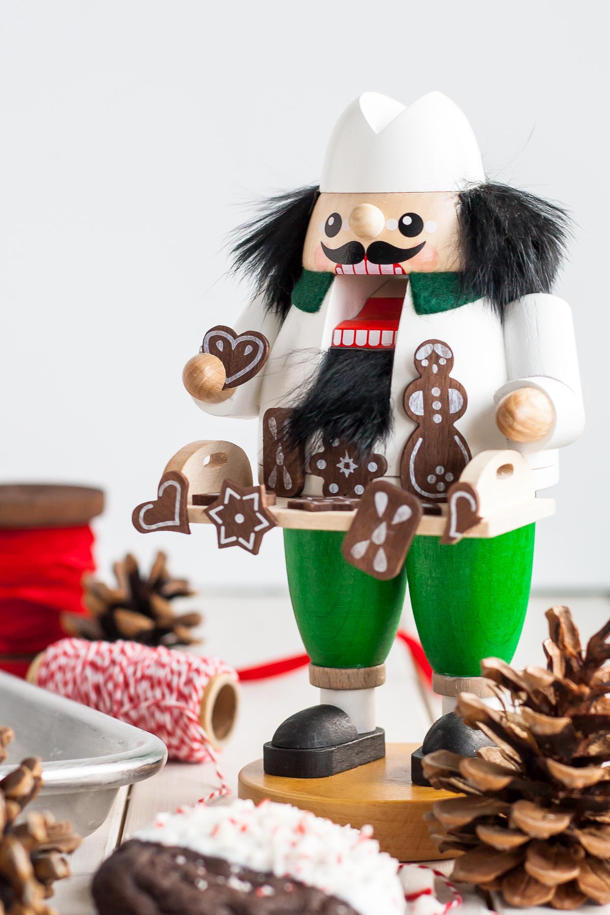 Dark Chocolate Candy Cane Cookies! The classic combination of chocolate and peppermint make these Dark Chocolate Candy Cane Cookies the perfect treat for the holidays! | livforcake.com German nutcracker - baker with holiday cookies